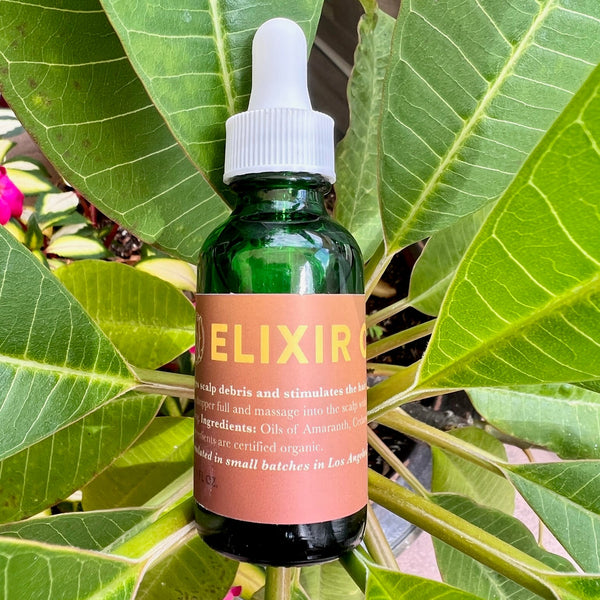 Stimulate your scalp with our Elixir Oil